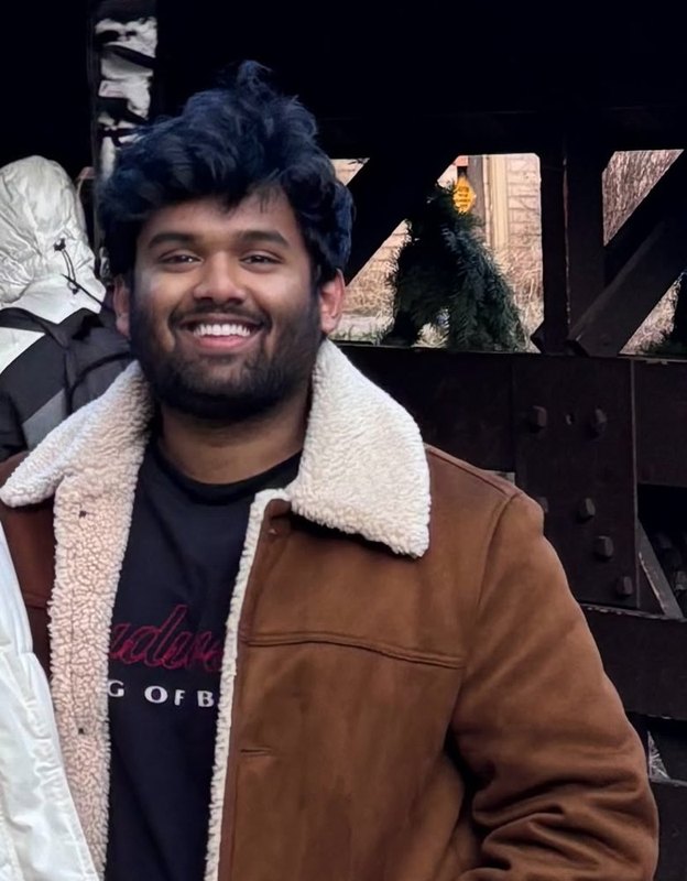 Sai Anirudh Siddi, AI engineer, smiling in a brown sherpa jacket